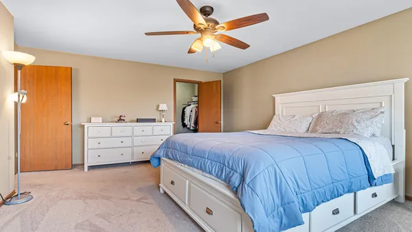 a bedroom with a bed and a cabinets