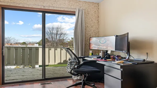a view of a workspace with furniture