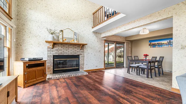 a view of a livingroom with furniture and a fireplace