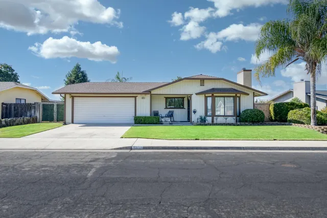a house view with a garden space