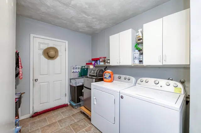 a view of storage and utility room with washer and dryer