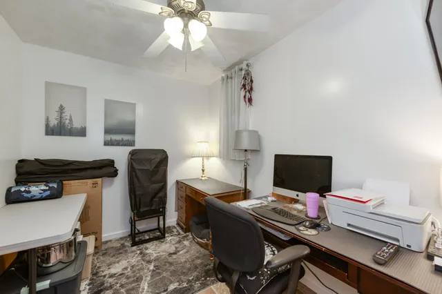 a view of a workspace with furniture