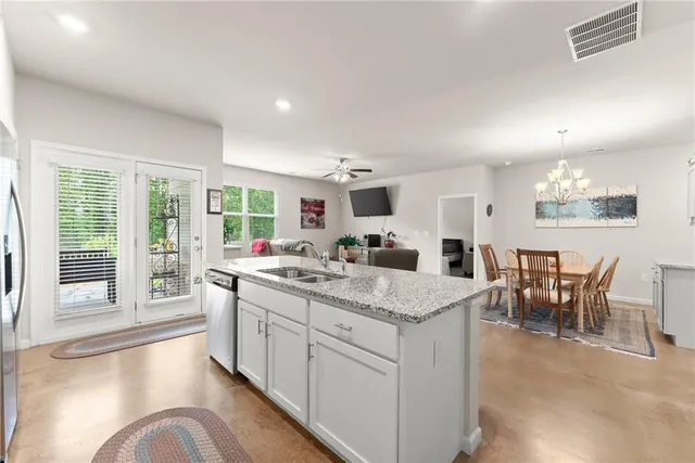 a view of a kitchen counter space with furniture and living room