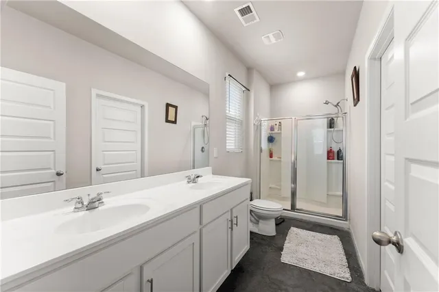a spacious bathroom with a double vanity sink mirror double and shower