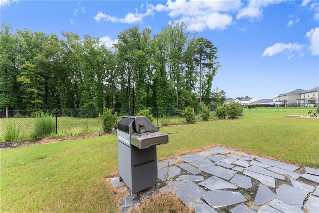 63 Conroe Court Hoschton, GA 30548 - Photo 30 of 44 a view of a lake with a yard