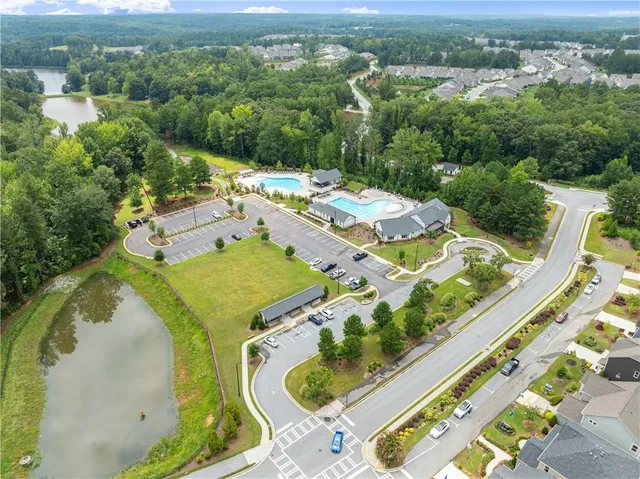 an aerial view of a house with yard swimming pool and outdoor seating