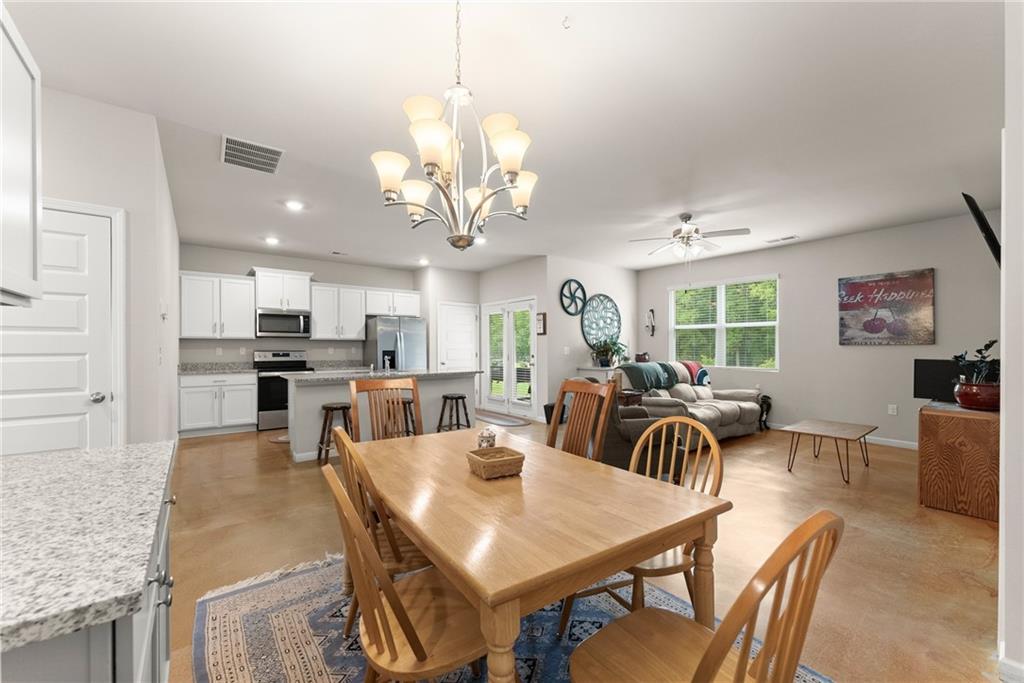 63 Conroe Court Hoschton, GA 30548 - Photo 8 of 44 a view of a dining room and livingroom view