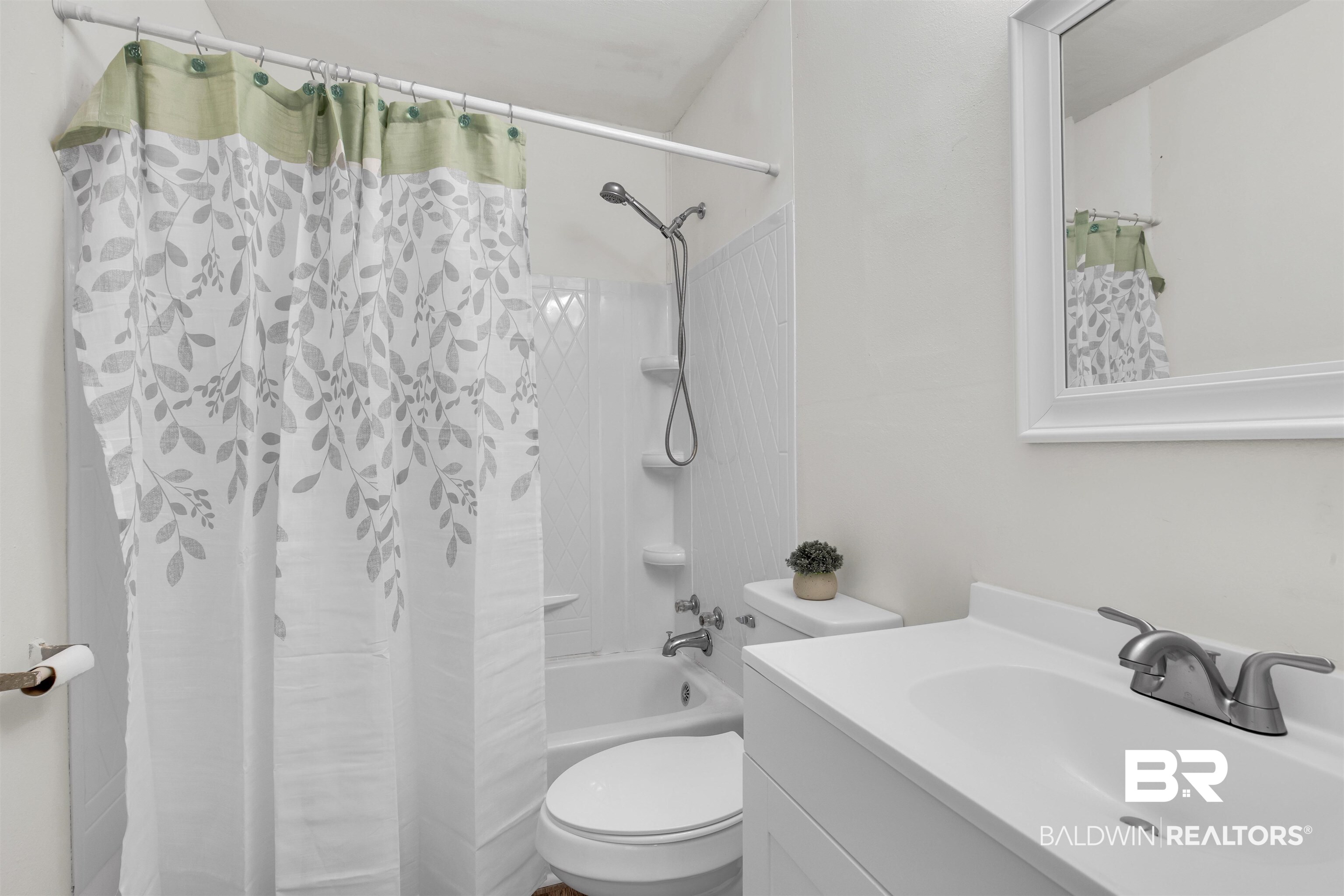 9241 Vallaris Street North Mobile, AL 36608 - Photo 8 of 17 Bathroom with toilet, vanity, and shower / tub combo with curtain