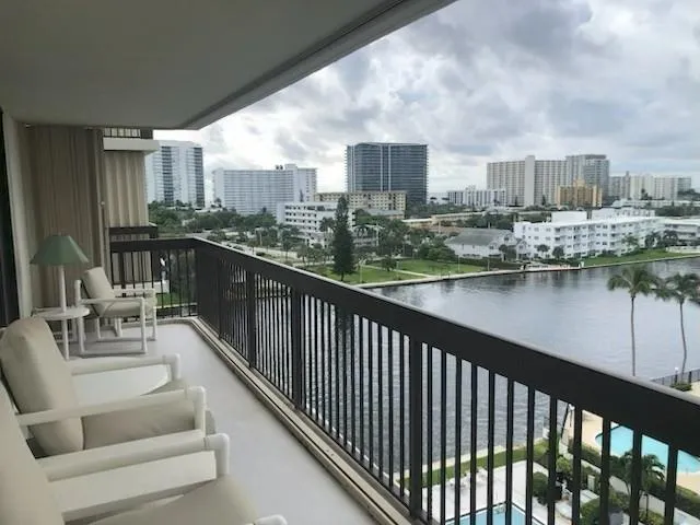 a view of balcony with outdoor seating and city view