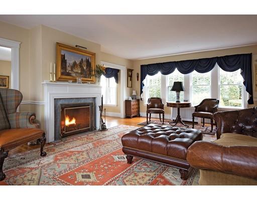 143 Windsor Road Newton, MA 02468 - Photo 2 of 9 a living room with furniture and a fireplace
