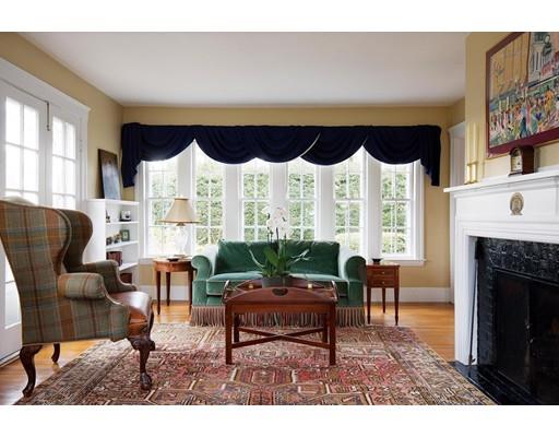 143 Windsor Road Newton, MA 02468 - Photo 5 of 9 a living room with furniture a fireplace and a large window
