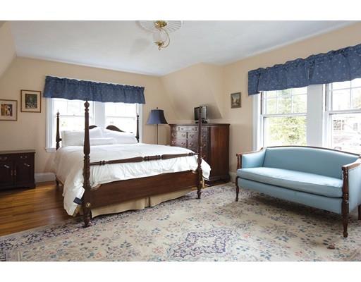 143 Windsor Road Newton, MA 02468 - Photo 6 of 9 a spacious bedroom with a bed a couch and large window