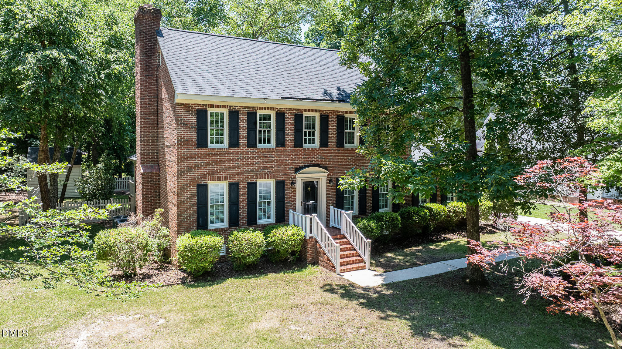 1215 Cambridge Road Northwest Wilson, NC 27896 - Photo 1 of 54 a front view of a house with a yard