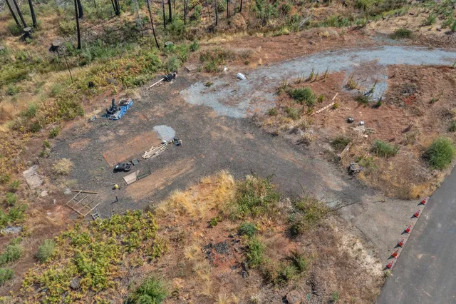 a fire hydrant in the middle of a field