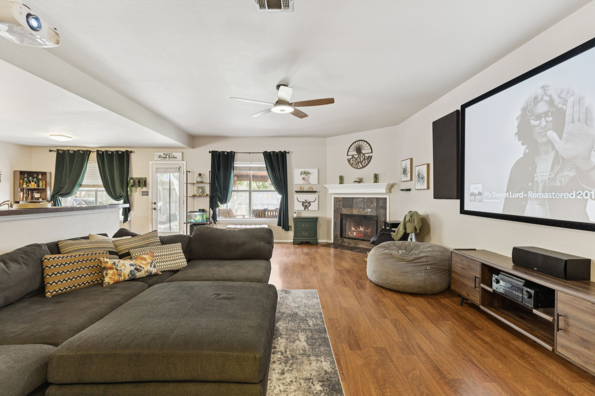 2412 Chestnut Path Round Rock, TX 78664 - Photo 2 of 26 Hard floors complement a cozy fireplace, setting the tone for relaxed living and entertainment.