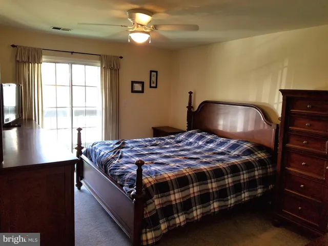 a room with a bed and a window