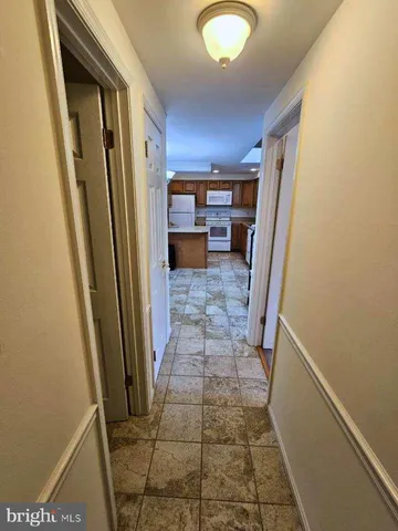 a view of a hallway with a front door