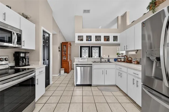 a view of a dining room with furniture and a clock