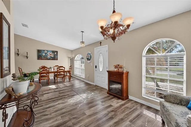 a spacious bathroom with a sink a mirror and a shower