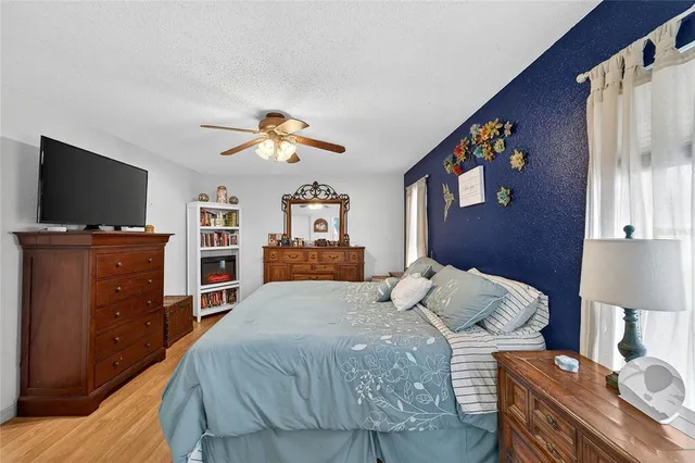 a view of a storage and utility room with closet dryer and washer