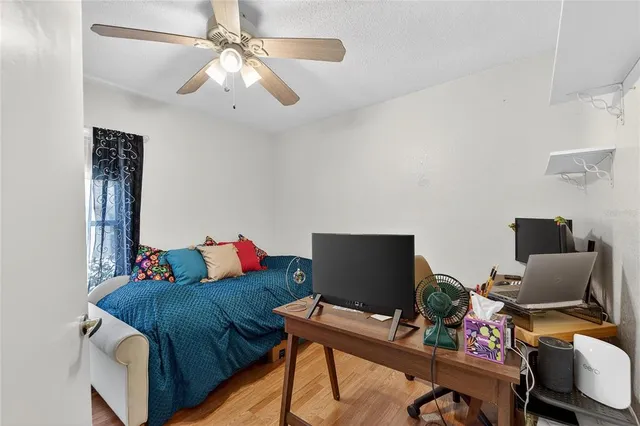 an aerial view of residential houses with outdoor space and swimming pool