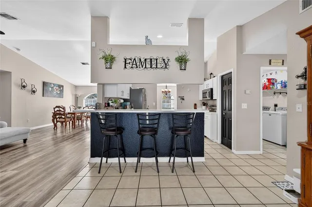 a kitchen with stainless steel appliances granite countertop a stove and a microwave