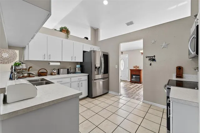 a view of a a dining room with furniture window and wooden floor