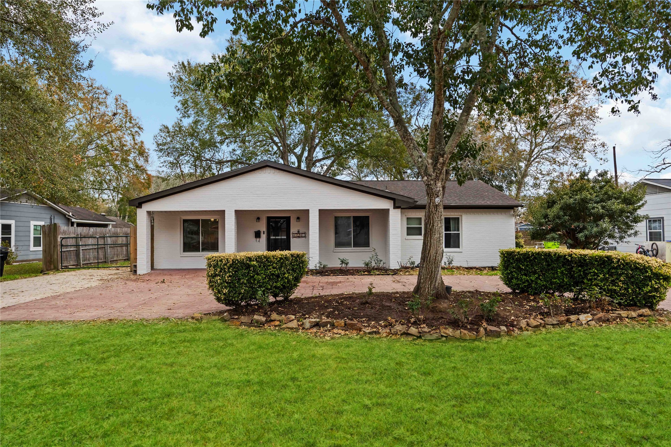 a front view of a house with garden