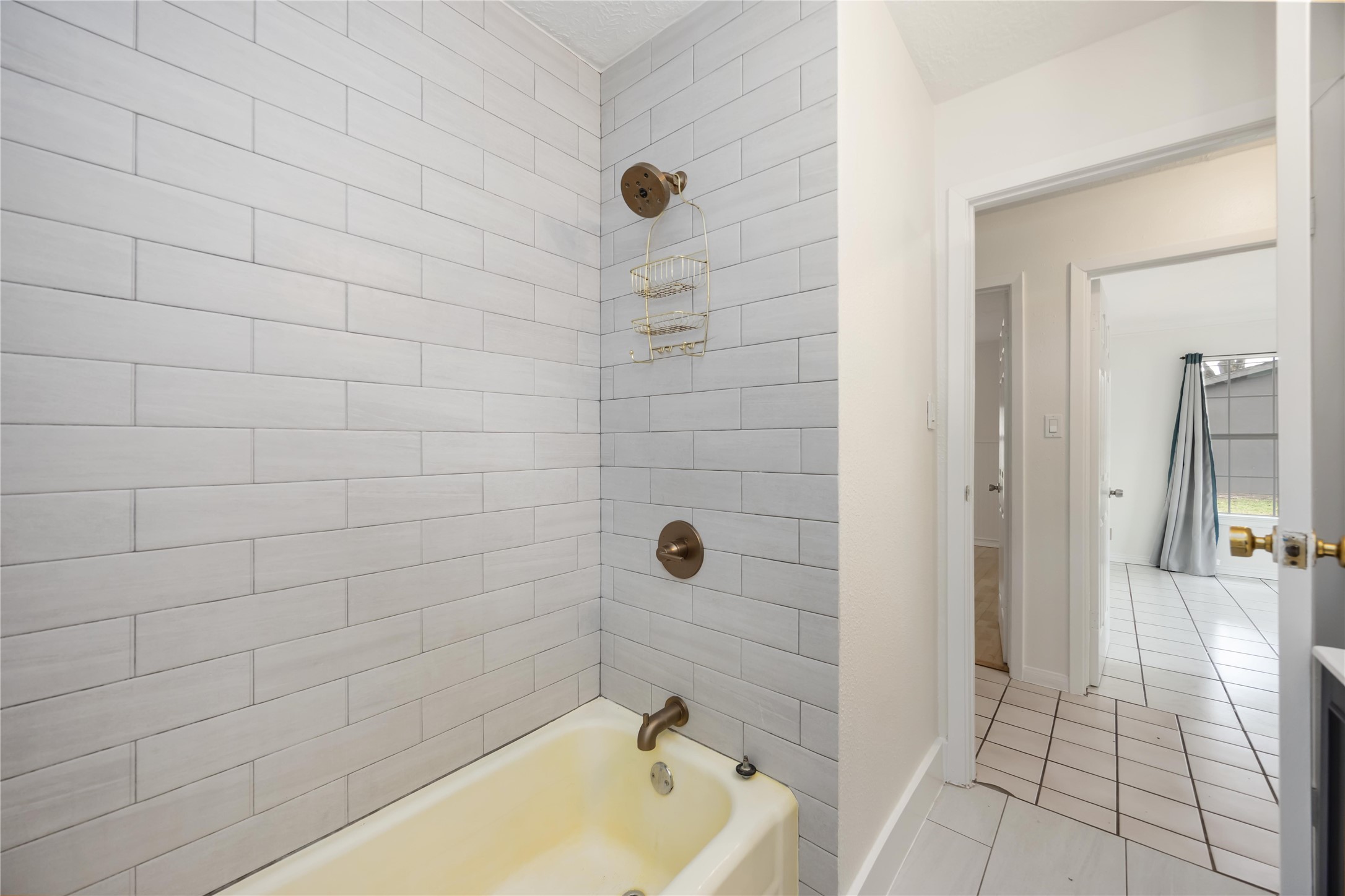 1721 Jones Street Rosenberg, TX 77471 - Photo 17 of 27 a bathroom with a tub and a shower