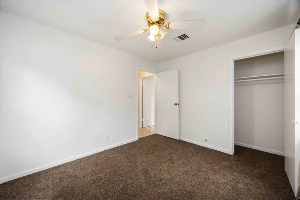 a view of a chandelier fan in a room