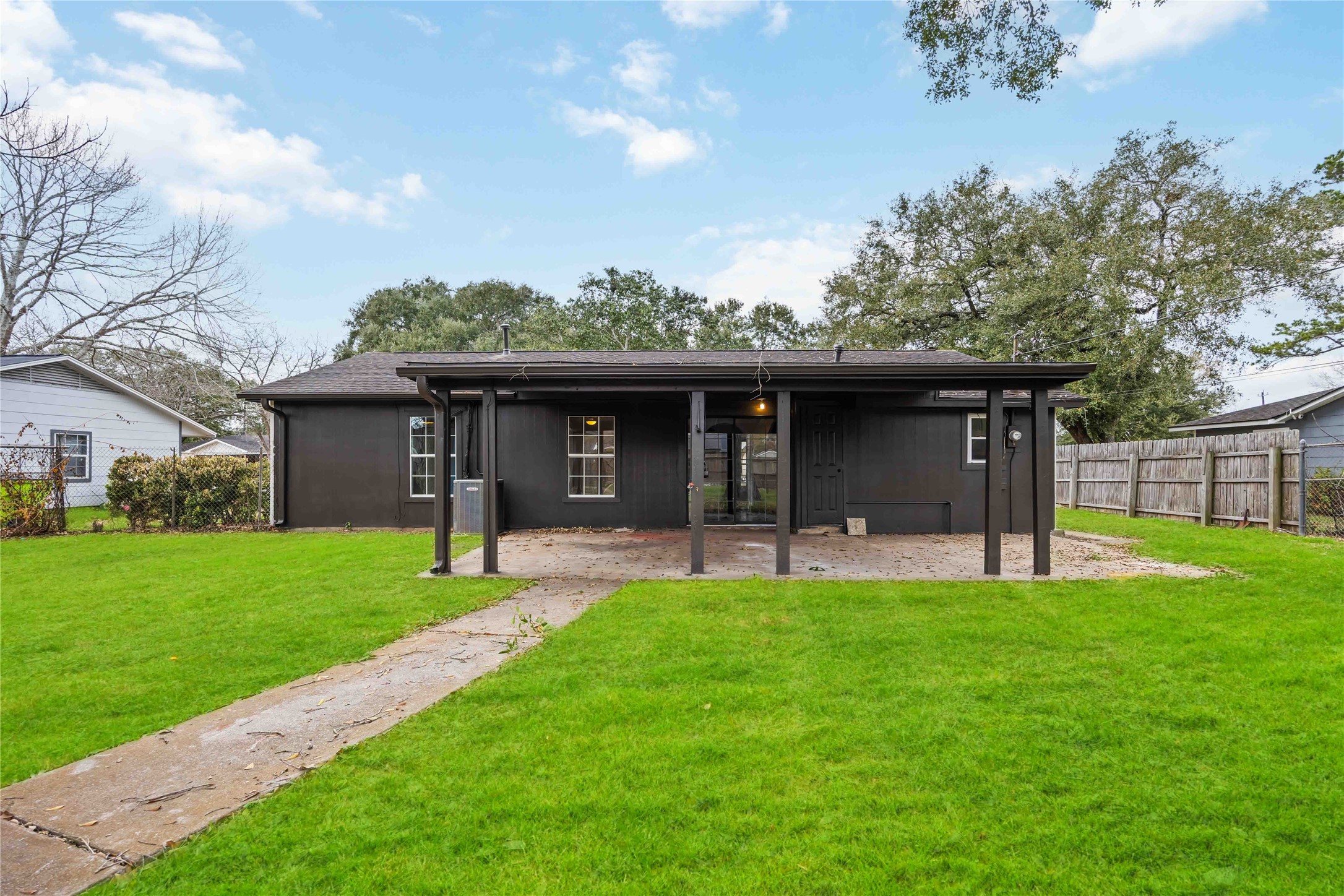 1721 Jones Street Rosenberg, TX 77471 - Photo 27 of 27 a view of a house with a yard and a large tree