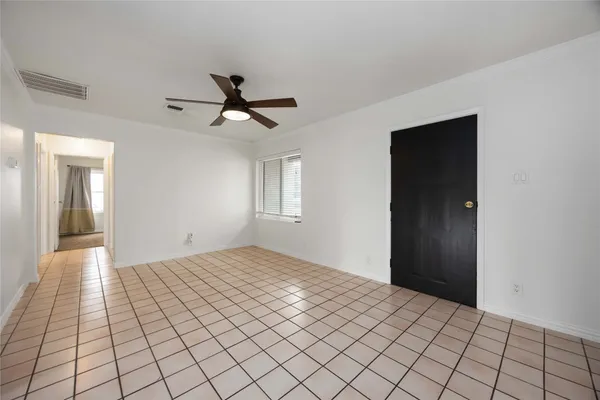 a view of an empty room and window