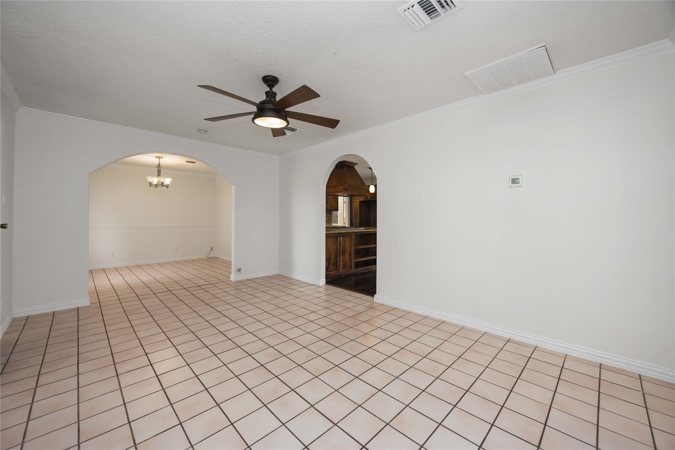 1721 Jones Street Rosenberg, TX 77471 - Photo 6 of 27 a view of a big room with wooden floor and windows