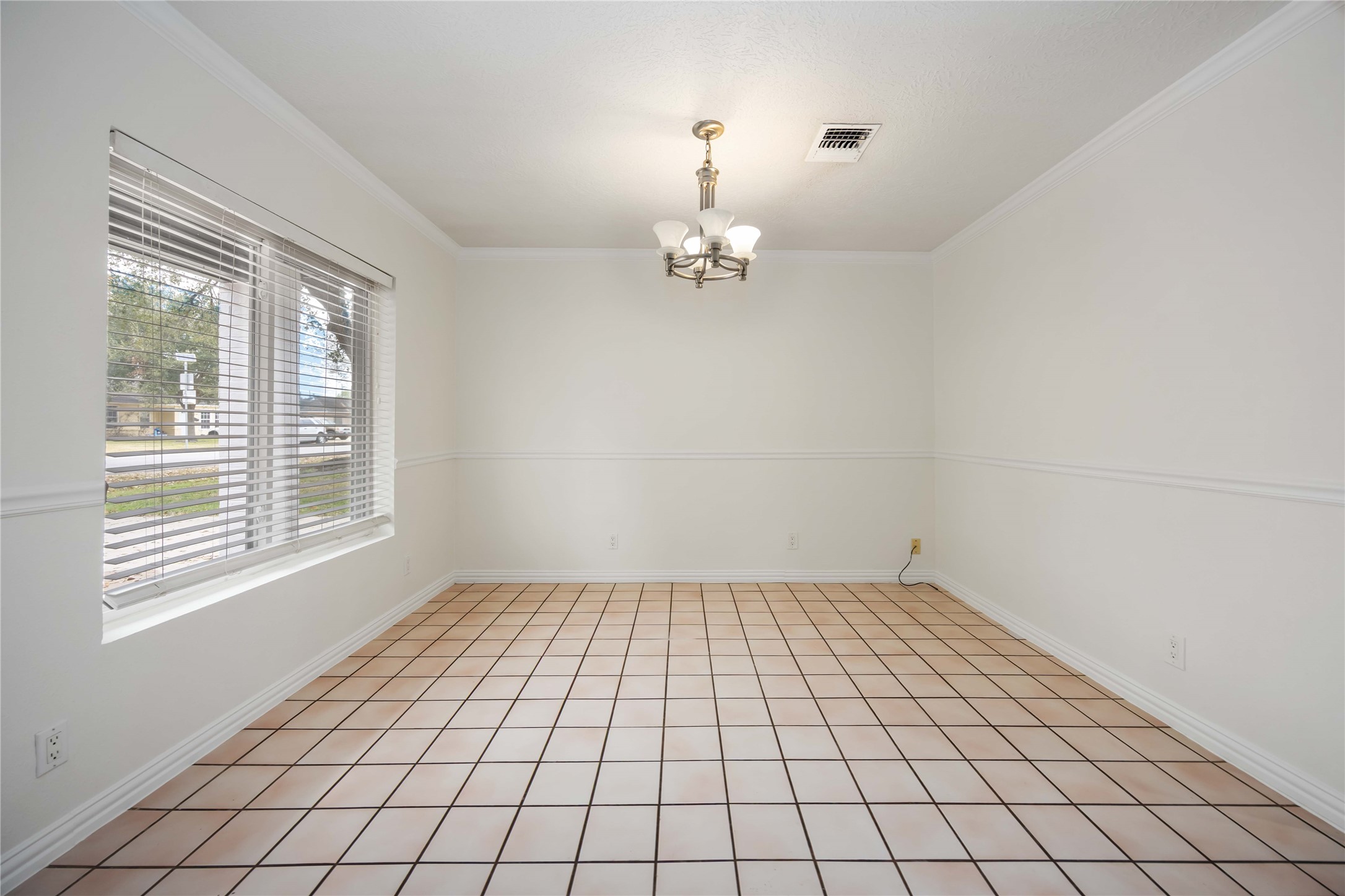 1721 Jones Street Rosenberg, TX 77471 - Photo 7 of 27 a view of an empty room with a window