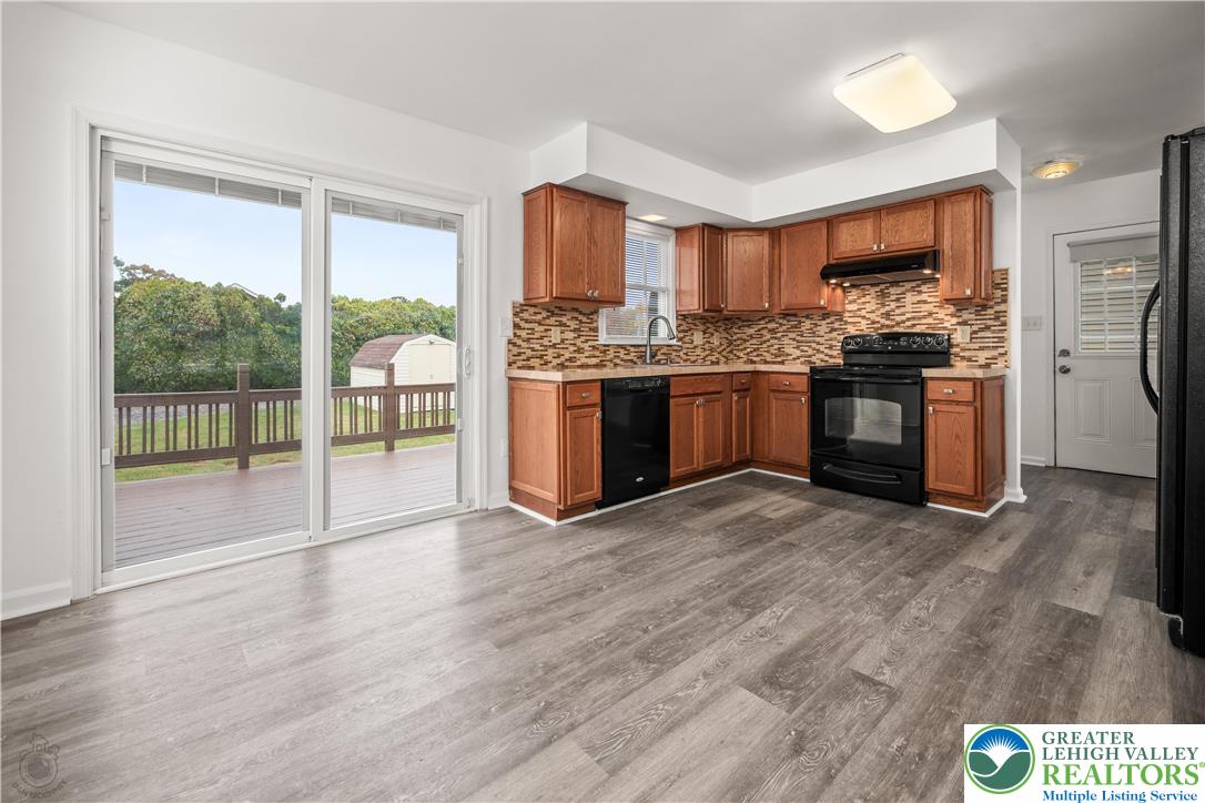 2735 Fairview Street Bethlehem, PA 18020 - Photo 13 of 43 a kitchen with stainless steel appliances granite countertop a stove a refrigerator a sink and a oven with wooden floor