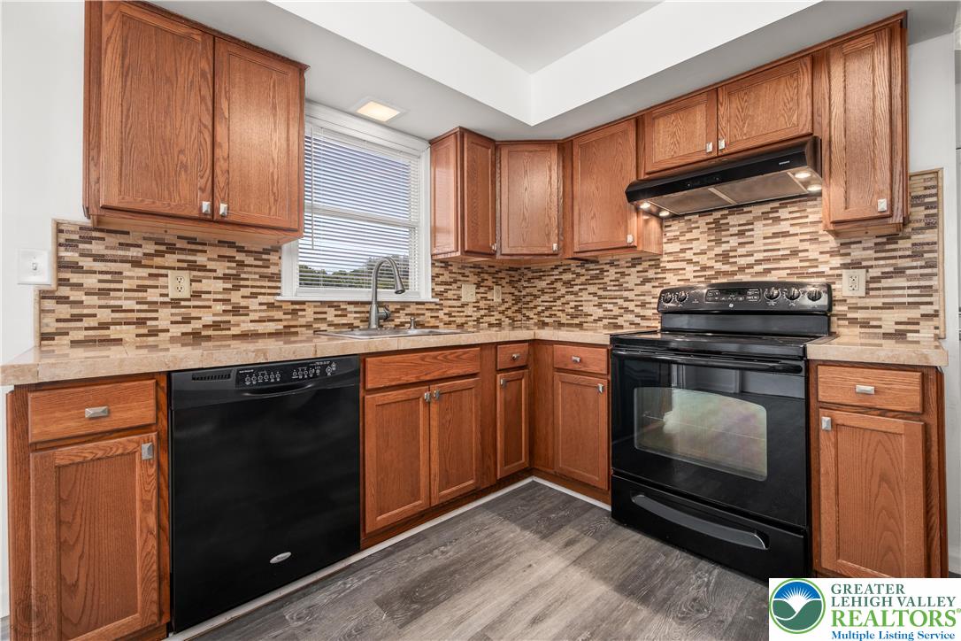 2735 Fairview Street Bethlehem, PA 18020 - Photo 15 of 43 a kitchen with granite countertop a stove sink and cabinets