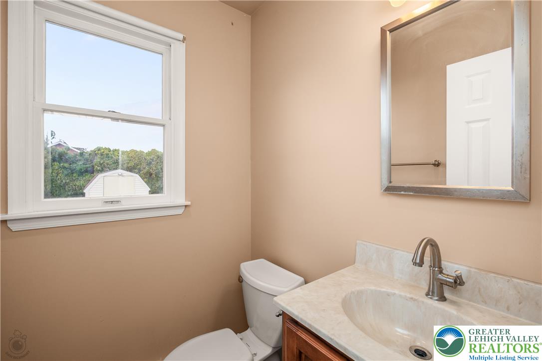 2735 Fairview Street Bethlehem, PA 18020 - Photo 17 of 43 a bathroom with a sink a toilet and a mirror