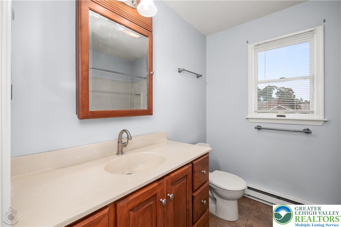 2735 Fairview Street Bethlehem, PA 18020 - Photo 19 of 43 a bathroom with a sink mirror vanity and toilet