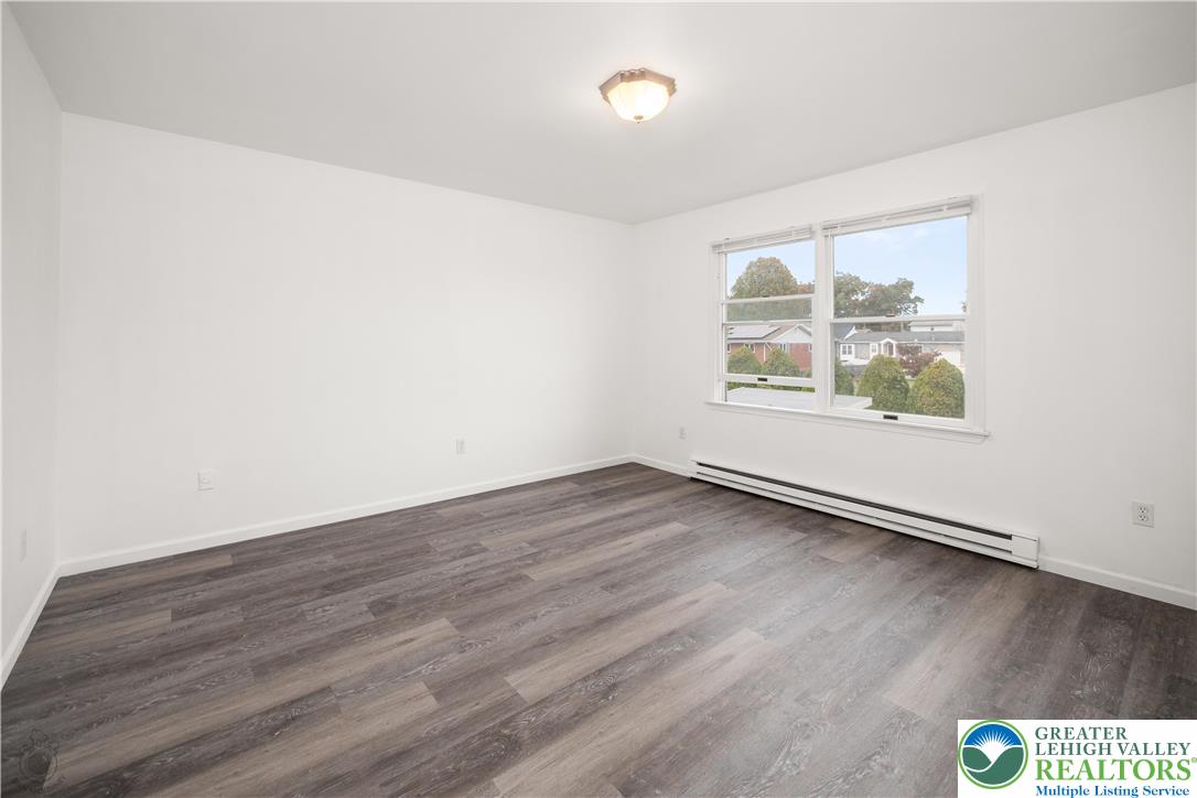 2735 Fairview Street Bethlehem, PA 18020 - Photo 20 of 43 an empty room with wooden floor and windows