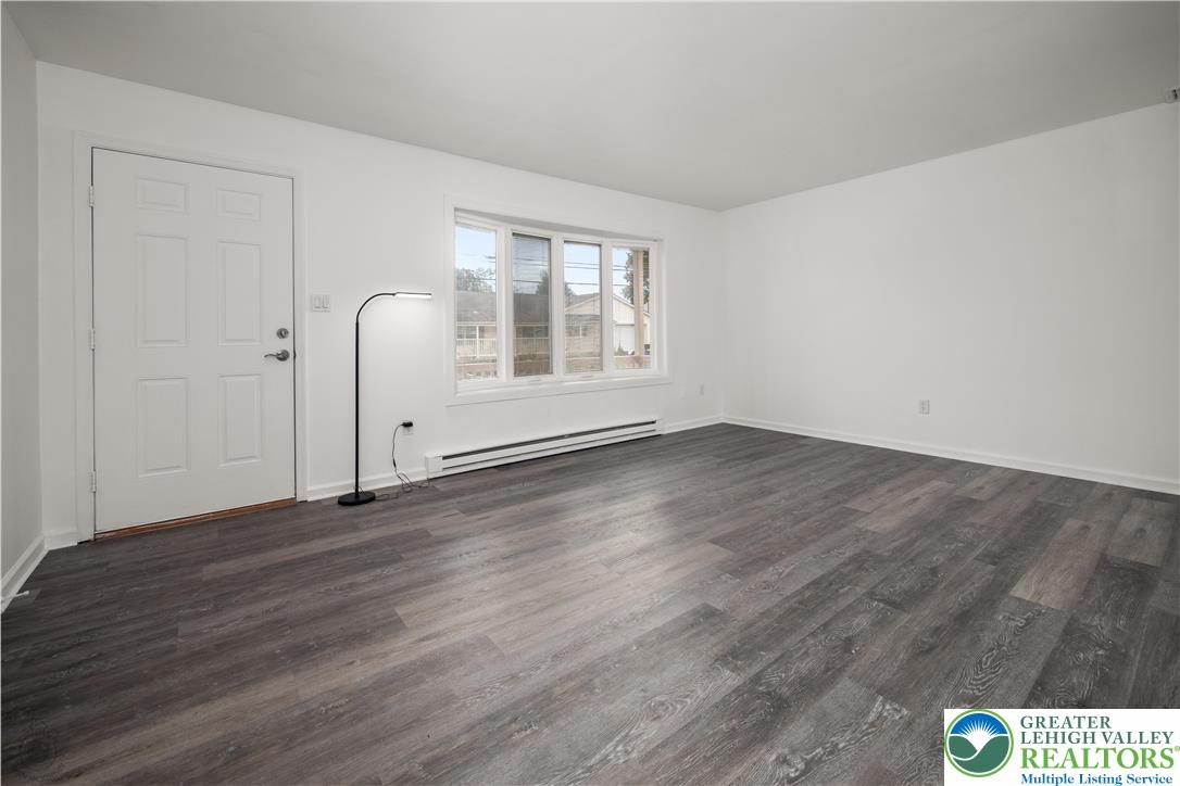 2735 Fairview Street Bethlehem, PA 18020 - Photo 7 of 43 an empty room with wooden floor and windows