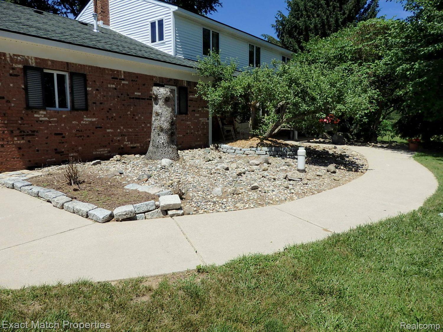 2980 East Rose Center Road Highland, MI 48356 - Photo 22 of 72 Concrete front walkway