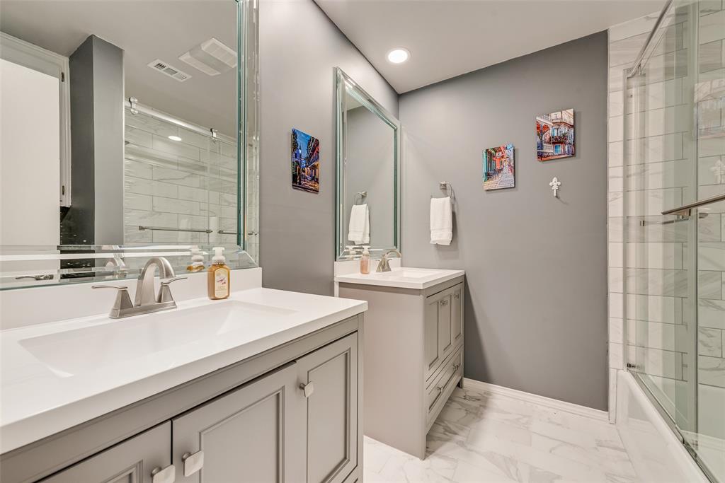 805 Crowley Road Arlington, TX 76012 - Photo 22 of 26 a bathroom with a sink double vanity and a mirror