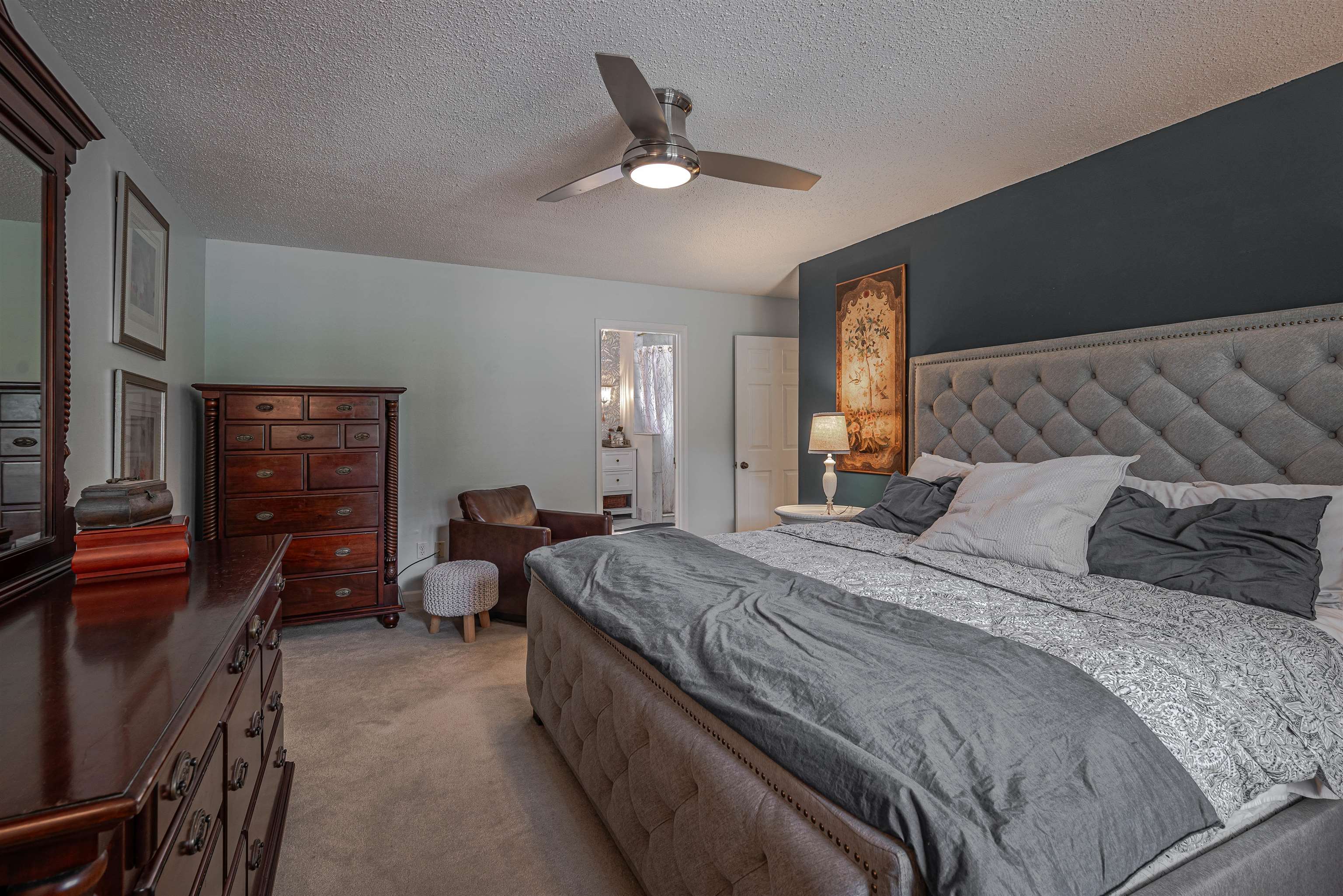 2006 Cordes Road Germantown, TN 38139 - Photo 17 of 36 Bedroom featuring light carpet, a textured ceiling, and ceiling fan