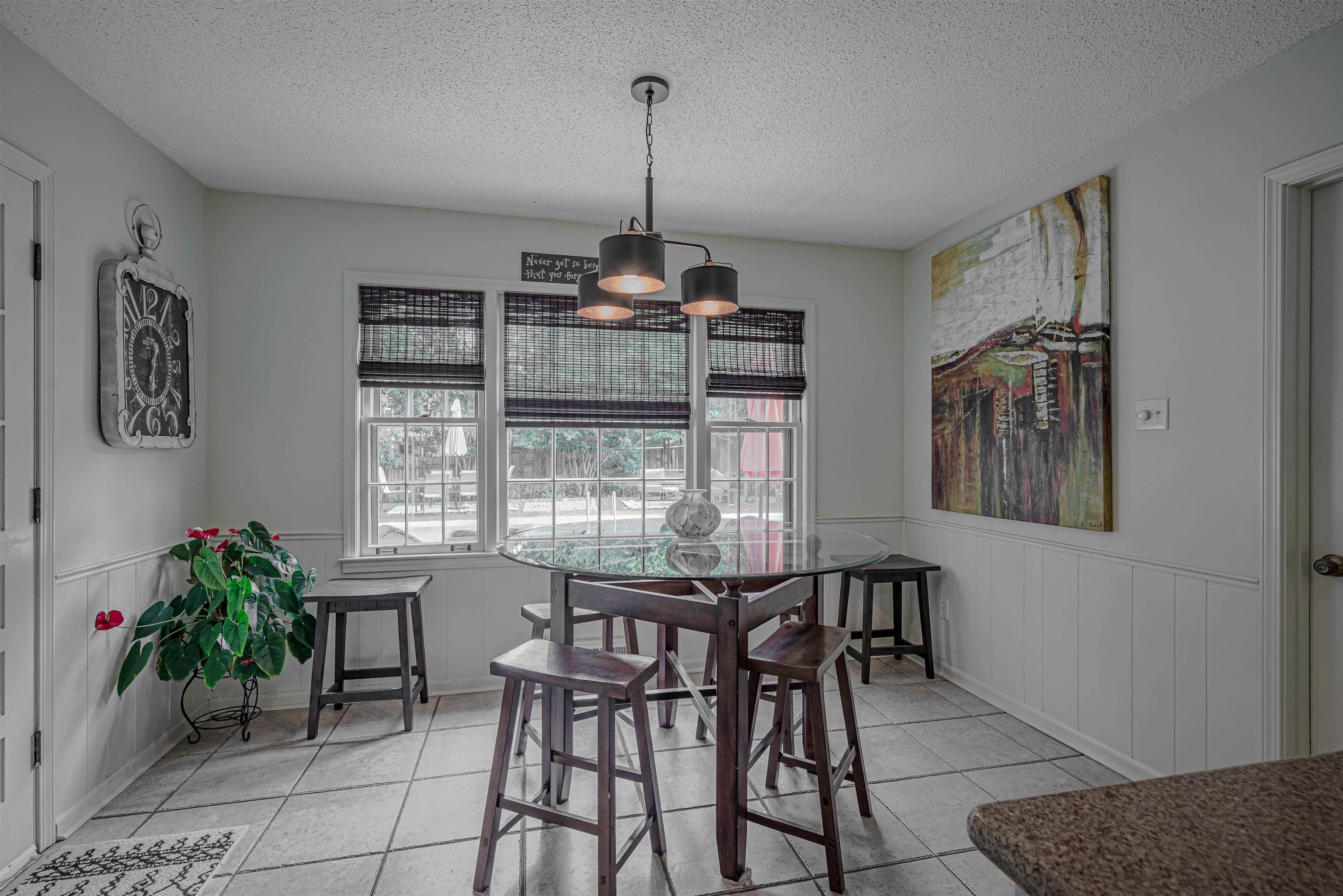 2006 Cordes Road Germantown, TN 38139 - Photo 10 of 36 Dining area with a textured ceiling, an inviting chandelier, and light tile patterned flooring