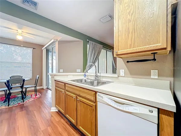 a kitchen with a sink and cabinets