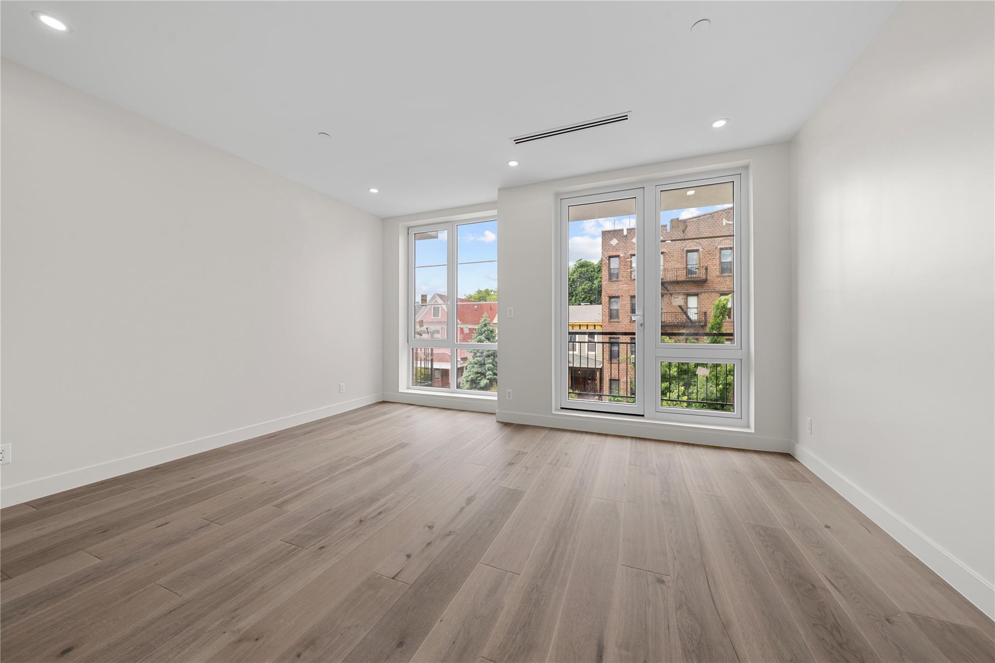 312 Fenimore Street Brooklyn, NY 11225 - Photo 20 of 37 Empty room with wood finished floors, baseboards, and recessed lighting