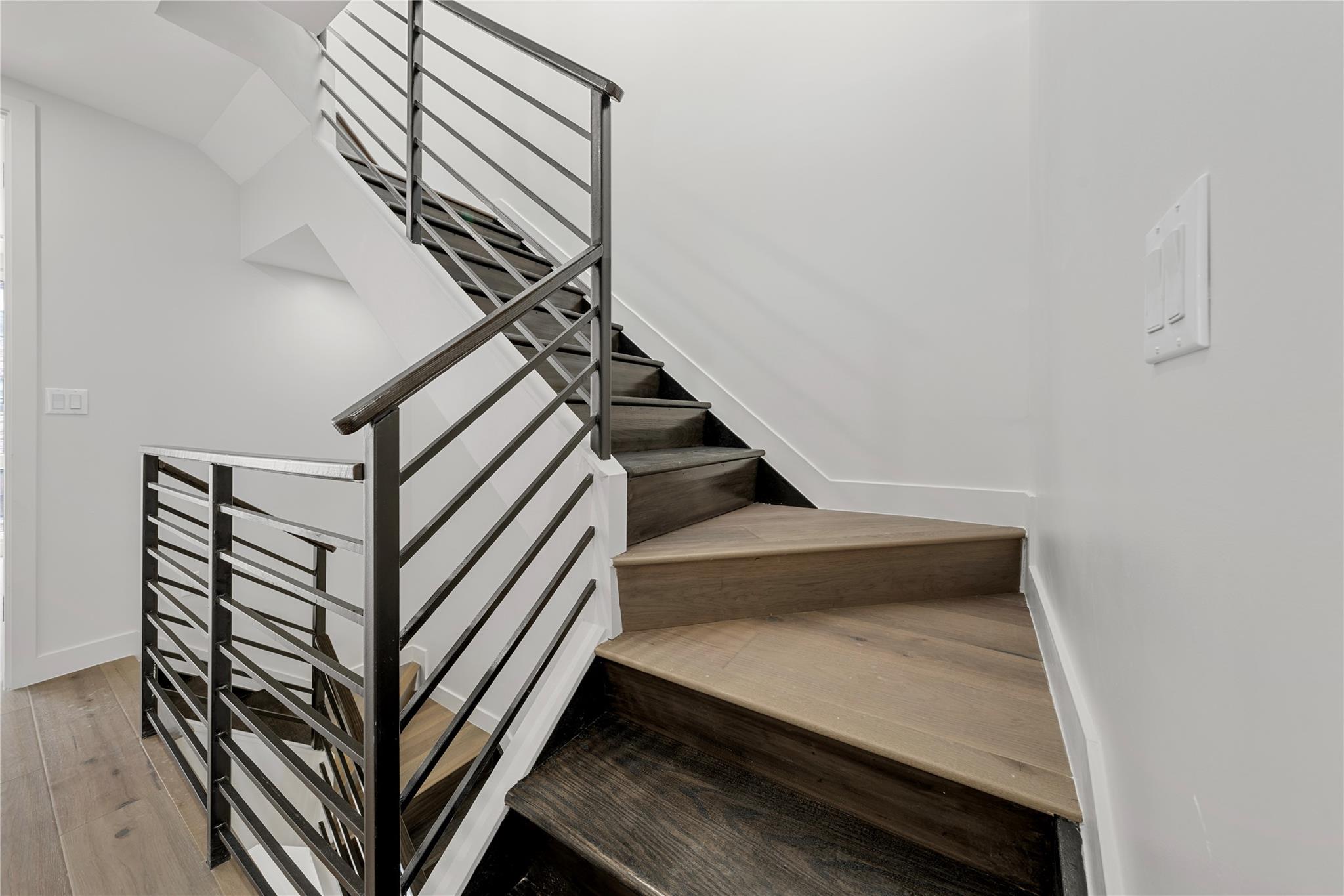 312 Fenimore Street Brooklyn, NY 11225 - Photo 31 of 37 Stairs featuring wood finished floors and baseboards