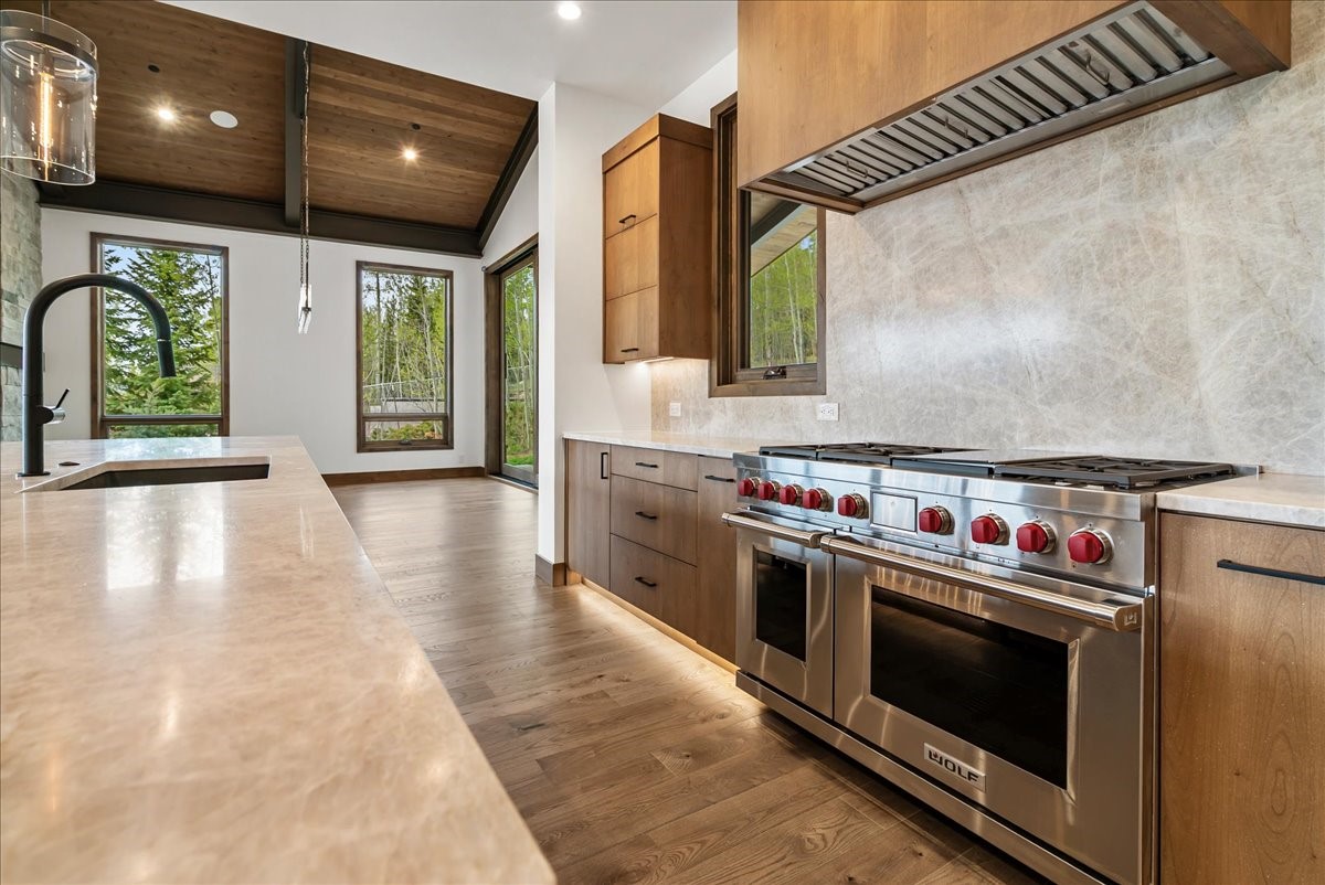 1615 Golden Eagle Road Silverthorne, CO 80498 - Photo 10 of 47 a kitchen that has a stove and a microwave