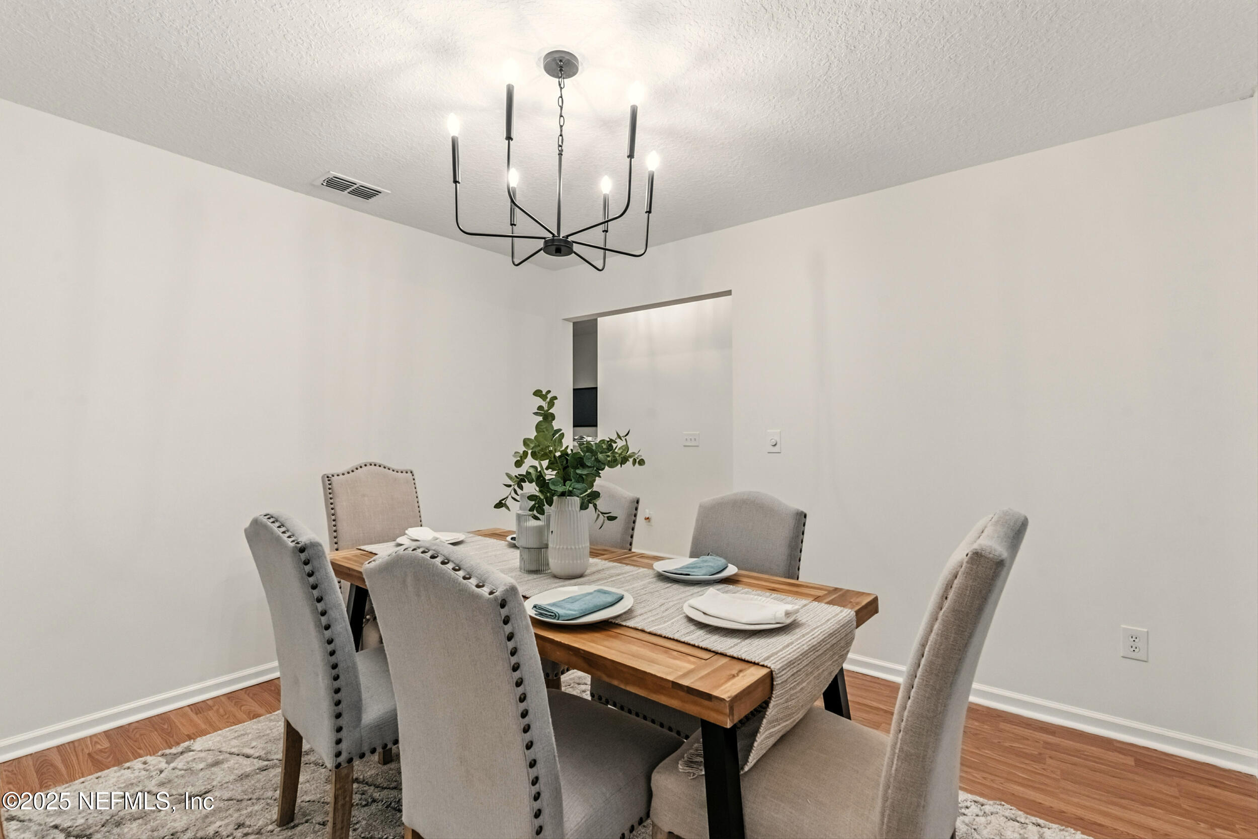 4385 Comanche Trail Boulevard St. Johns, FL 32259 - Photo 12 of 33 a view of a dining room with furniture and wooden floor