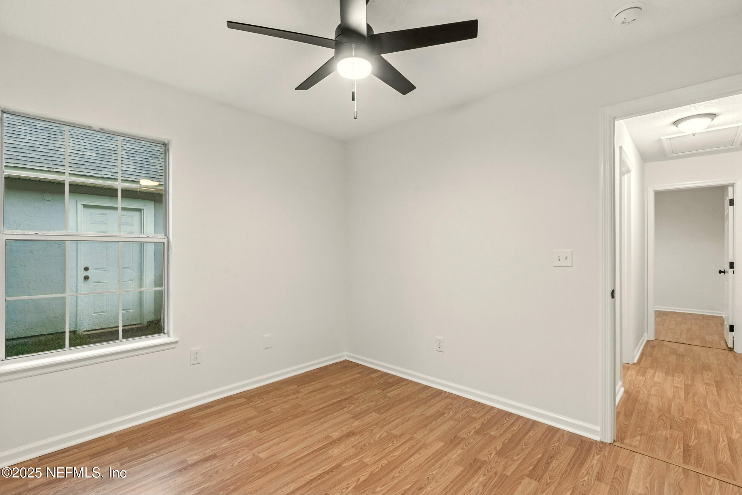 4385 Comanche Trail Boulevard St. Johns, FL 32259 - Photo 23 of 33 a view of empty room with wooden floor and fan